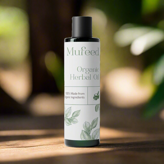 Mufeed Organic Herbal Oil bottle on a wooden surface with a blurred natural background