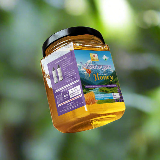 Jar of honey with a label on a white background