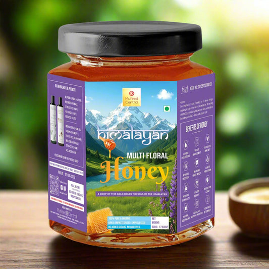 Jar of Himalayan multi-floral honey with a purple label on a white background